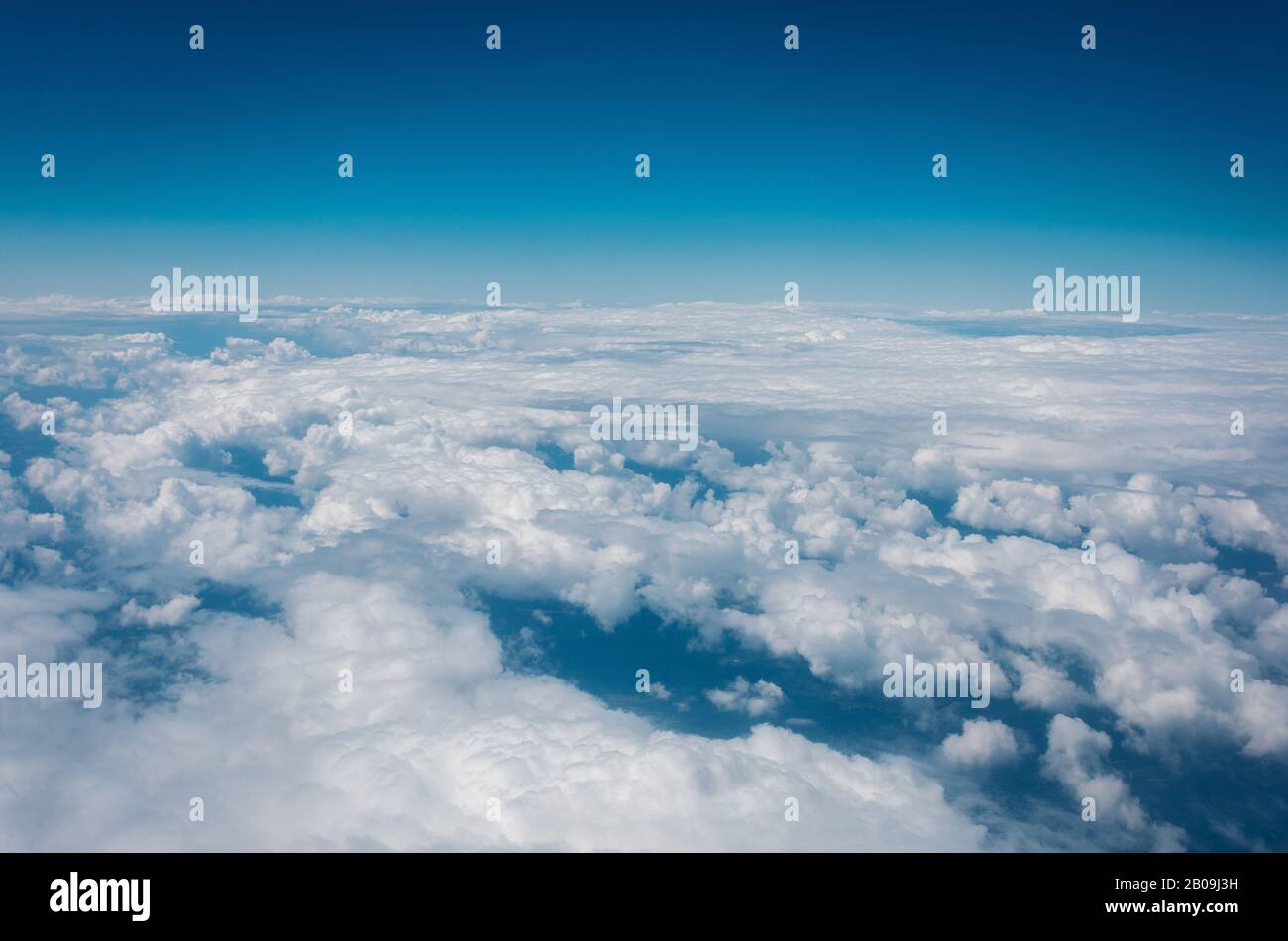 Sky with clouds from airplane window during flight Stock Photo - Alamy