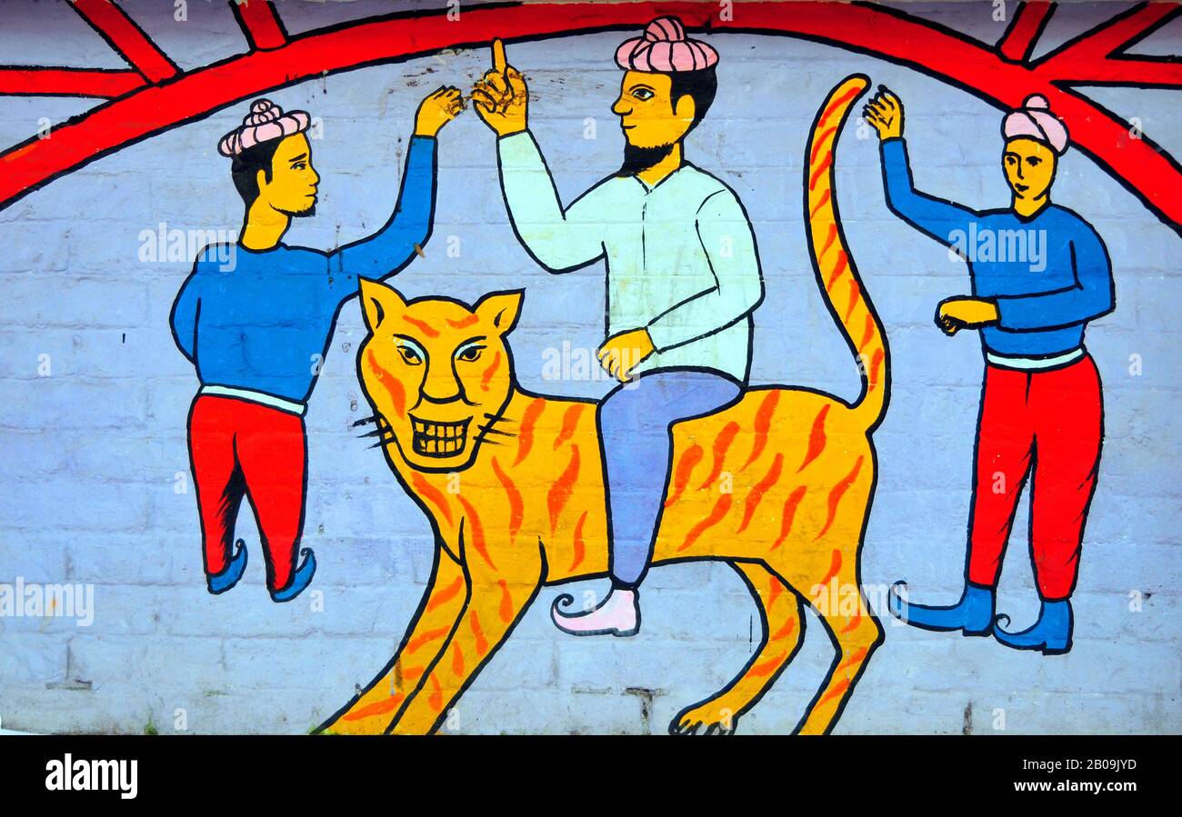 A mural depicts characters from Bangladeshi folk tales on the boundary wall of the Fine Art Institute of Dhaka University, ahead of Bangla New Year (1416) festival Pahela Baishakh. Dhaka, Bangladesh. April 13, 2009. Stock Photo