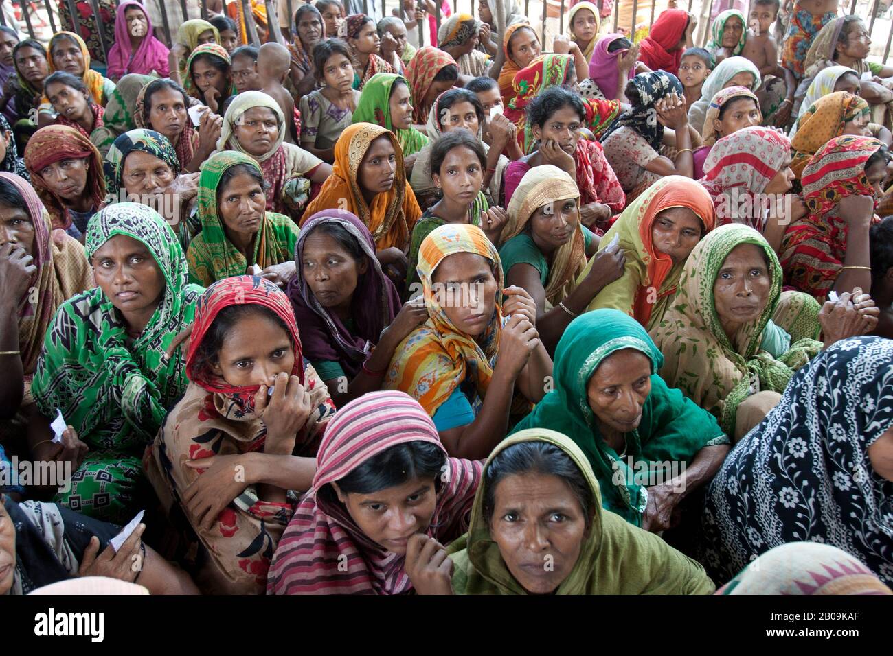 Women from flood affected areas gather at a flood relief centre in Keraniganj, Dhaka, Bangladesh. August 9, 2007. Stock Photo