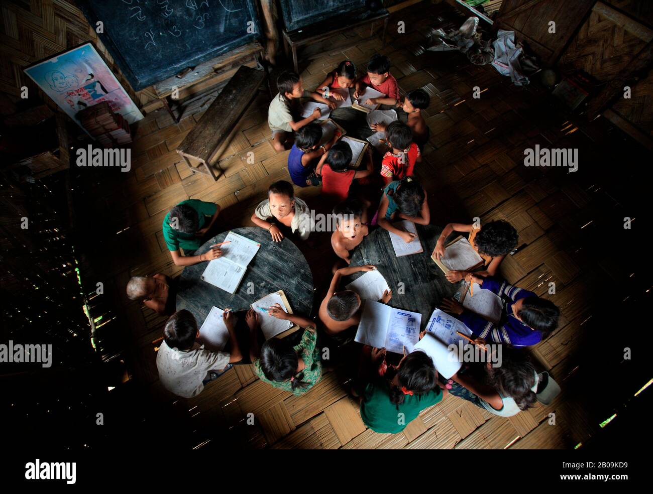 Children from ethnic communities study at a non-formal primary school, in Ruma, Bandarban, Bangladesh. September 15, 2010. Stock Photo