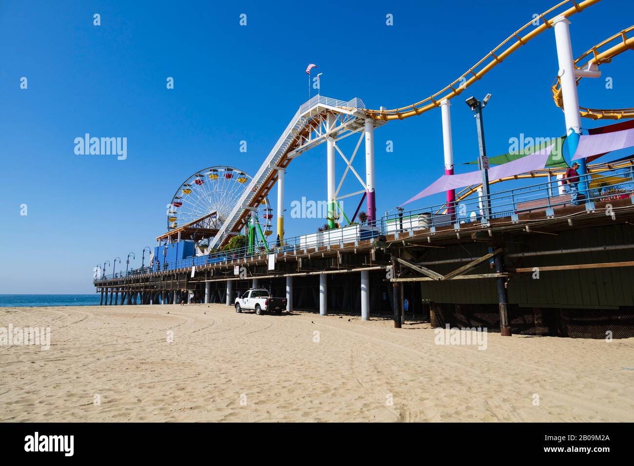 Big wheel and roller coaster amusements on Santa Monica pier, Los Angeles, California, United States of America Stock Photo