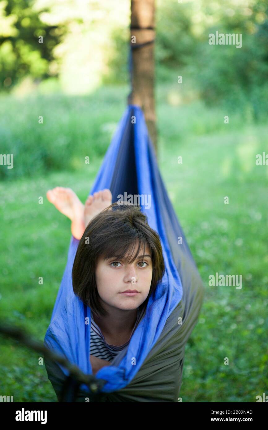 beautiful teen girl in hammock Stock Photo
