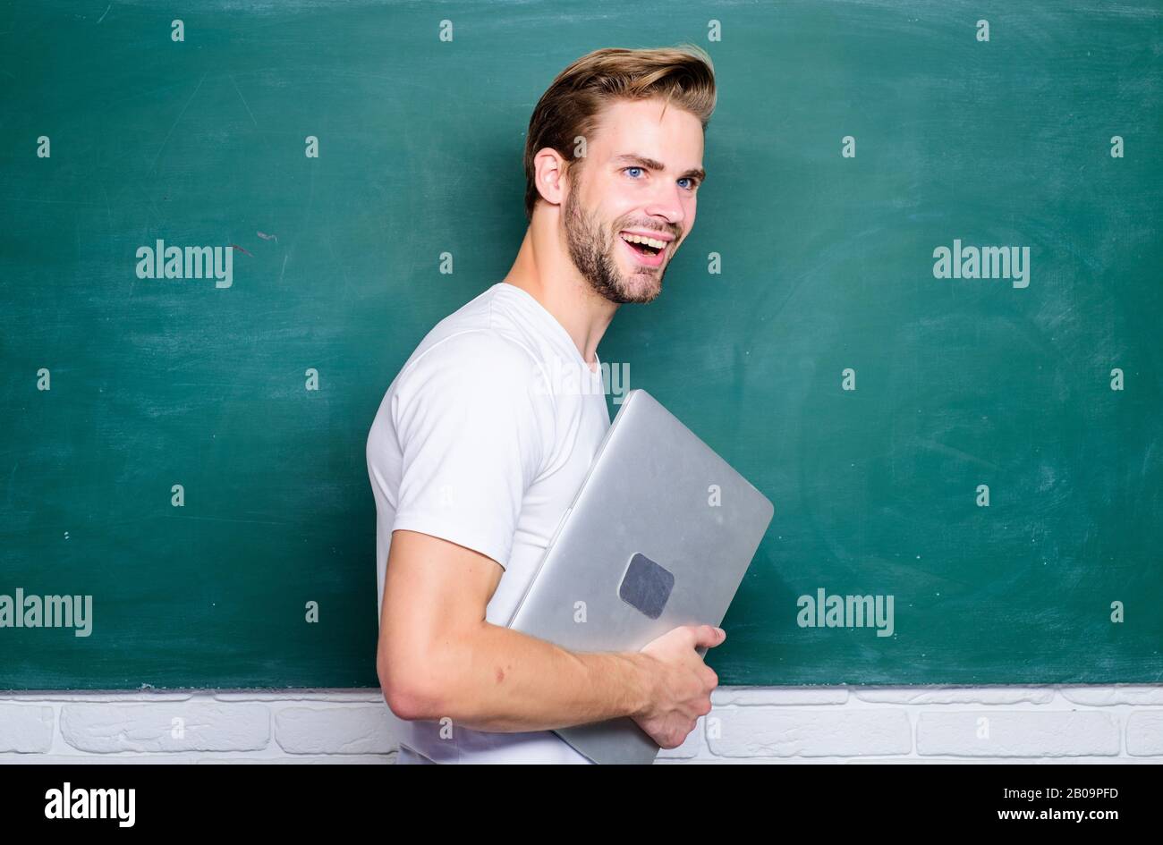 Security online life. Programming web development. Digital concept. Online communications. School teacher with laptop. Handsome man use modern technologies. Digital technology. Learn digital sciences. Stock Photo
