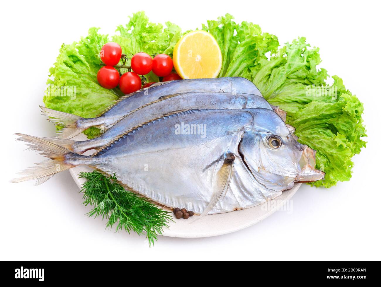 Vomer setapinnis (selene pisces) Group of dried fish at plate . Seafood