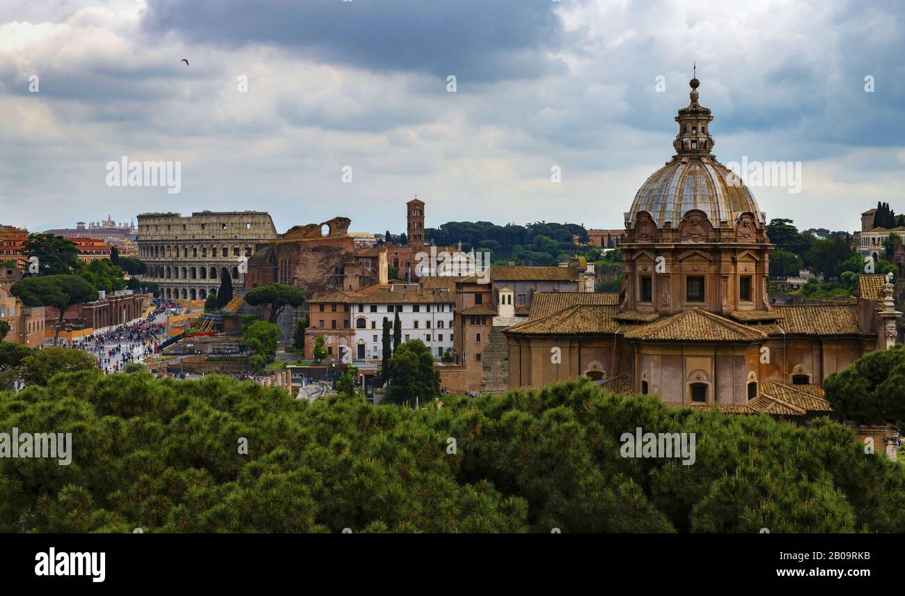 Colosseum and church in Rome under cloudy sky Stock Photo - Alamy