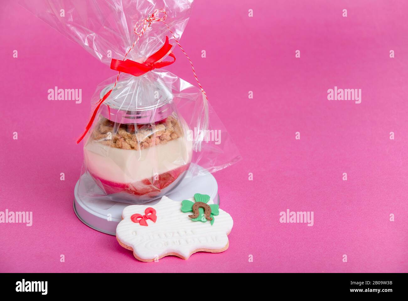 package of jar with creams on pink background, nice gift in March Stock Photo