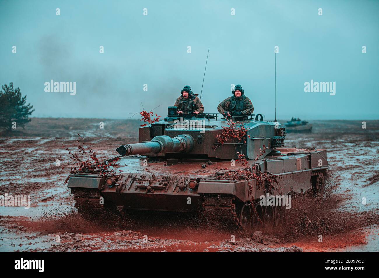 Polish Soldiers, assigned to the 1st Warsaw Armored Brigade operate a Leopard 2 tank during a multinational training scenario in support of NATO enhanced Forward Presence Battle Group Poland February 6, 2020 in Bemowo Piskie, Poland. The NATO enhanced Forward Presence consists of four battalion-sized battle groups deployed on a persistent rotational basis to Estonia, Latvia, Lithuania and Poland. Stock Photo