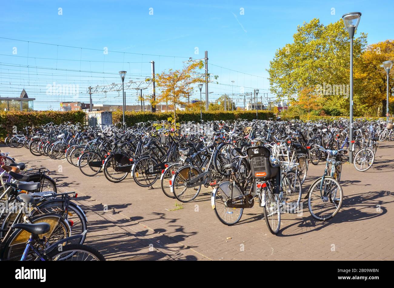 Venlo, Limburg, Netherlands - October 13, 2018: Rows of parked bicycles in the Dutch city close to the main train station. City biking. Eco-friendly means of transport. Horizontal photo. Stock Photo