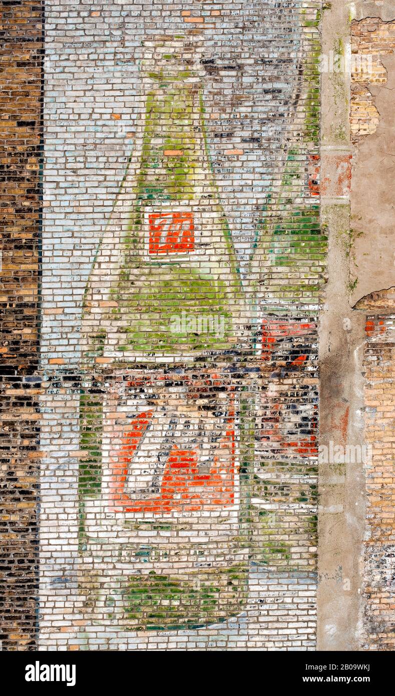 A faded and hand painted 1960's sign for the beverage 7-up on a brick wall in downtown Minneapolis, Minnesota, USA Stock Photo