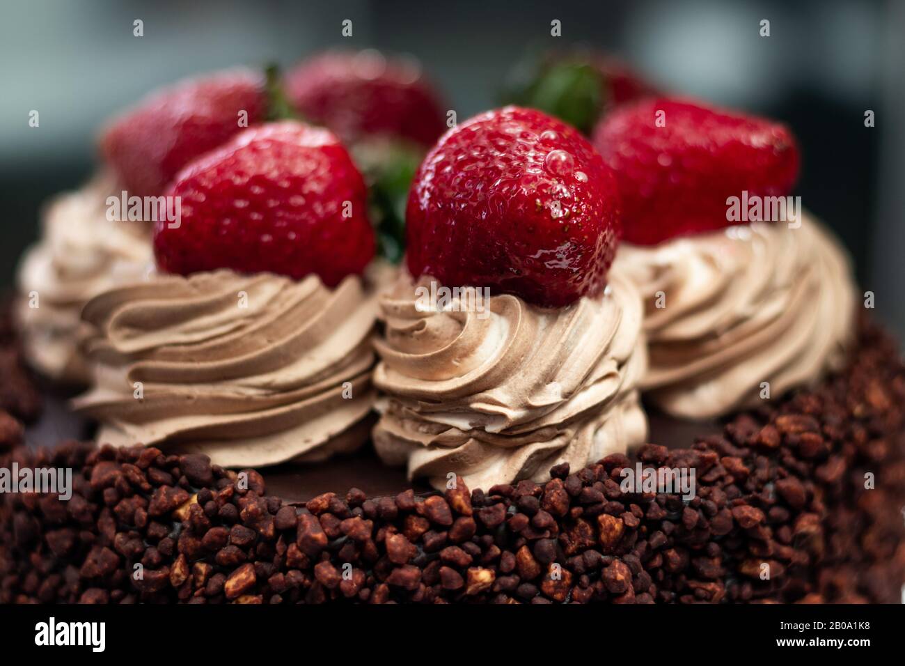 Chocolate cake with strawberries on the top Stock Photo - Alamy