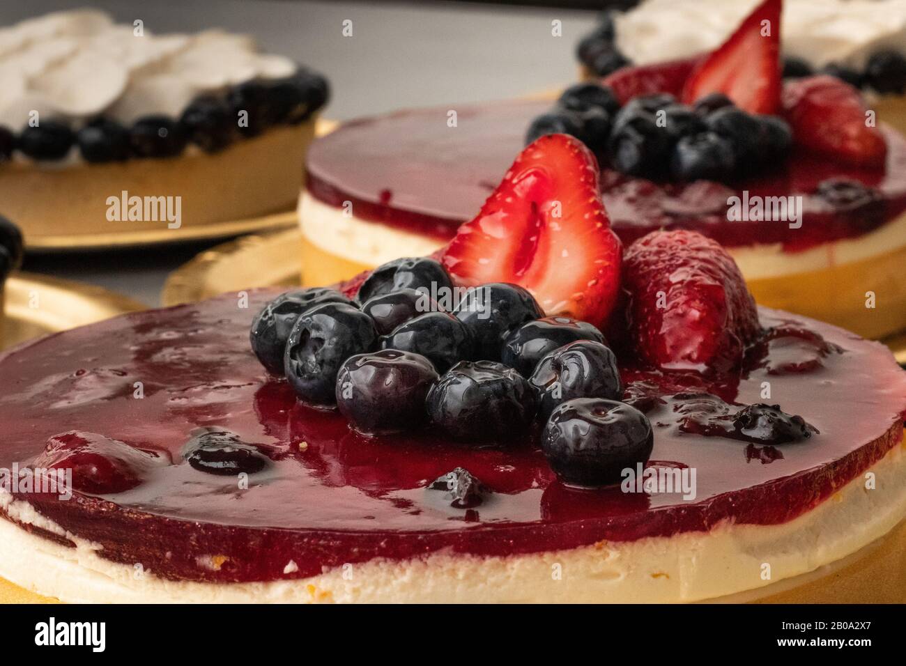 Fresh cheesecake with strawberry topping Stock Photo