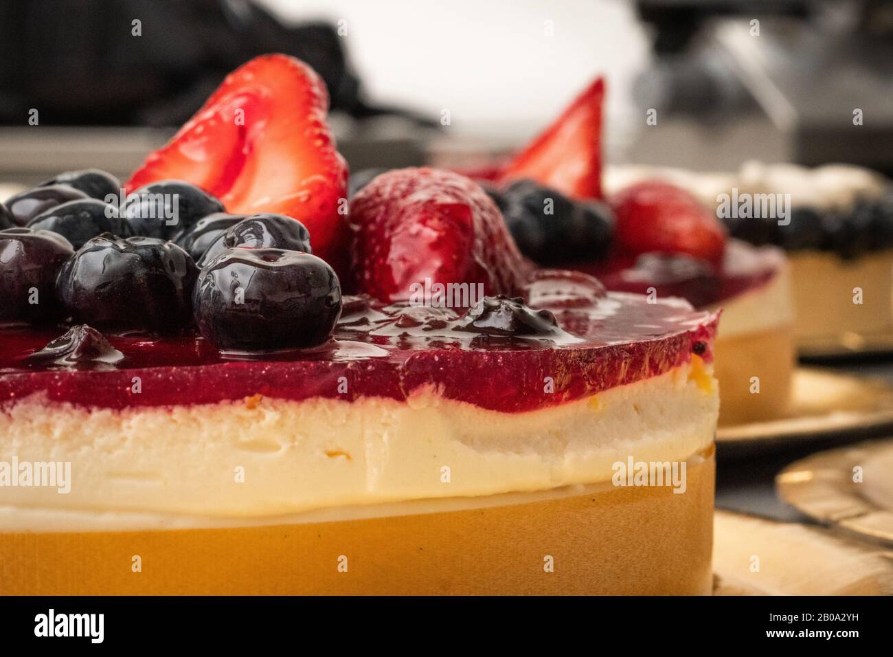 Fresh cheesecake with strawberry topping Stock Photo