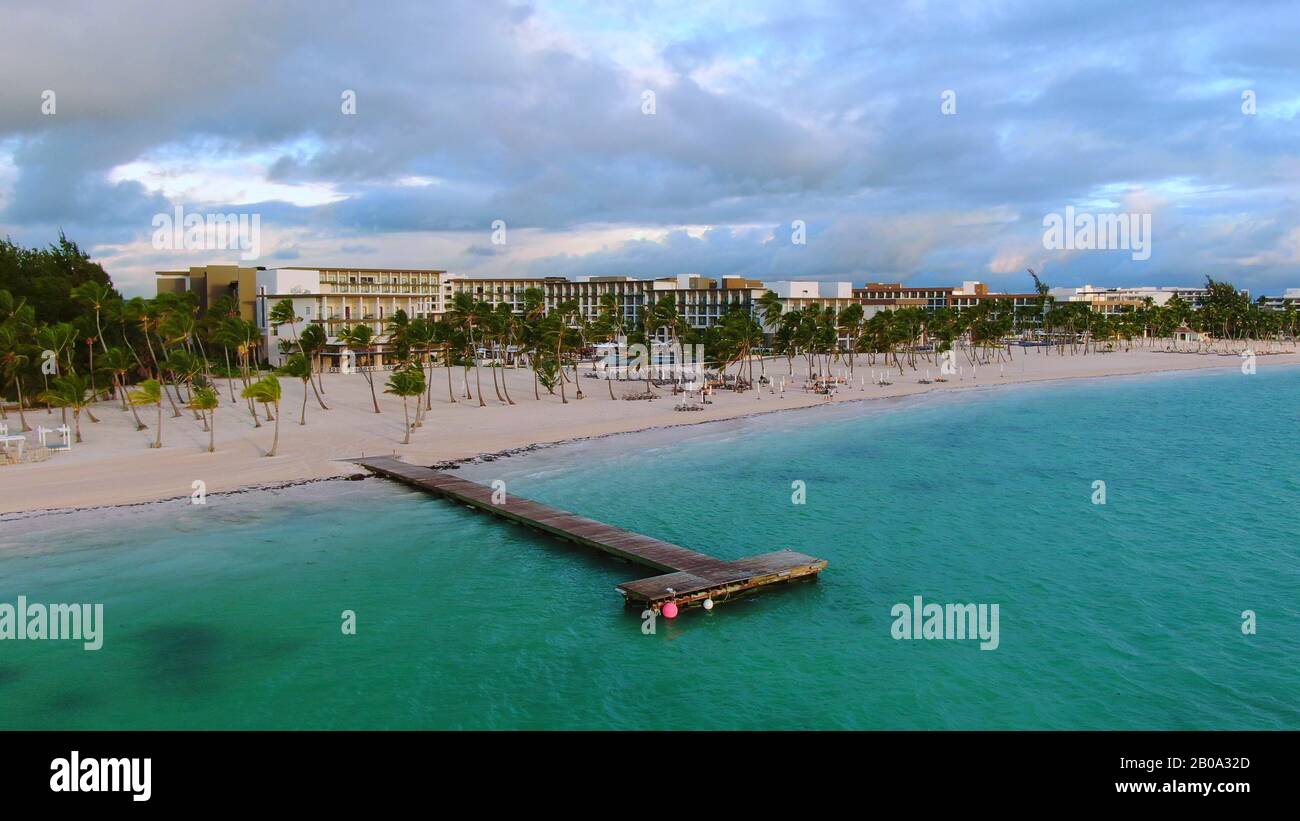 Tropical paradise beach, white sand, palm trees and wooden jetty, pier ...