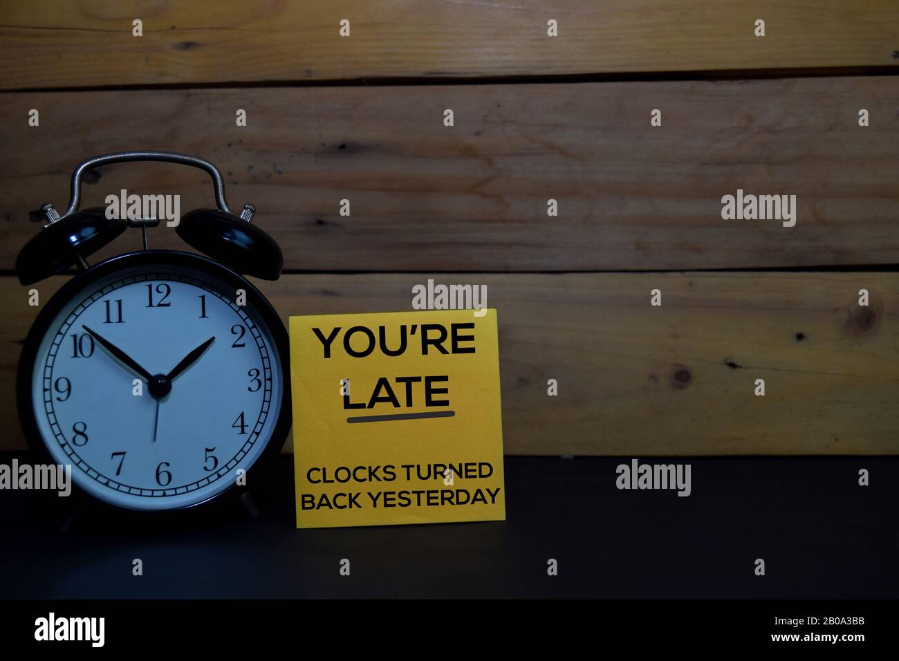 You're Late Clocks Turned Back Yesterday write on a sticky note