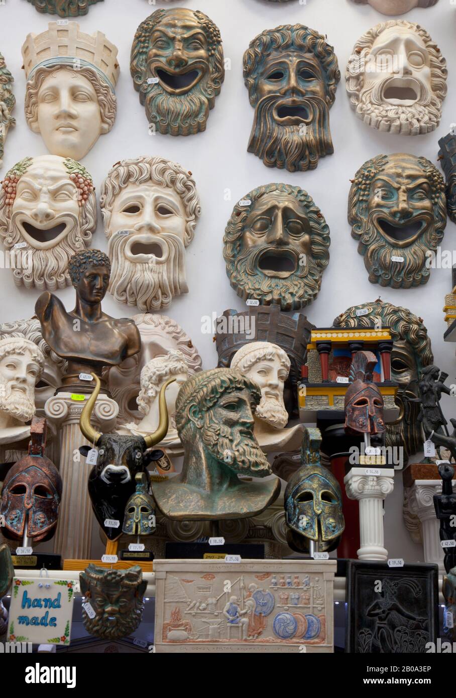 Souvenirs, including greek masks and statuettes,  for sale in a tourist shosp Agios Nikolaos in Crete, Grece. August 2018 Stock Photo