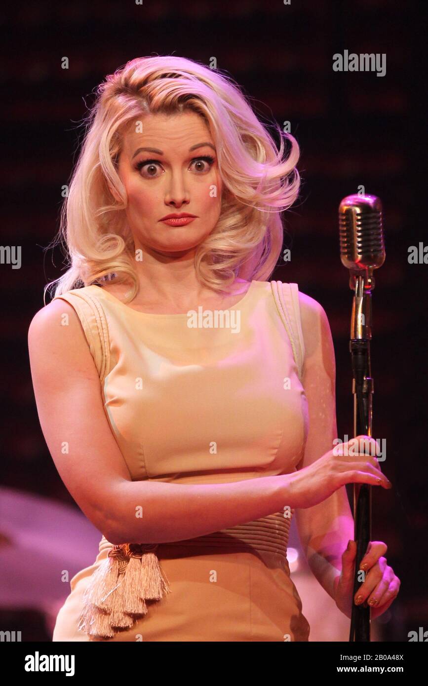 LAS VEGAS, NV - DECEMBER 4: Holly Madison takes the stage during a special encore performance of Million Dollar Quartet performing the Elvis Presley and Ann-Margaret duet, 'The Lady Loves Me' from the film, 'Viva Las Vegas' at the Harrah's Las Vegas Showroom in Las Vegas, Nevada on December 4, 2013. Credit: mpi34/MediaPunch Inc. Stock Photo