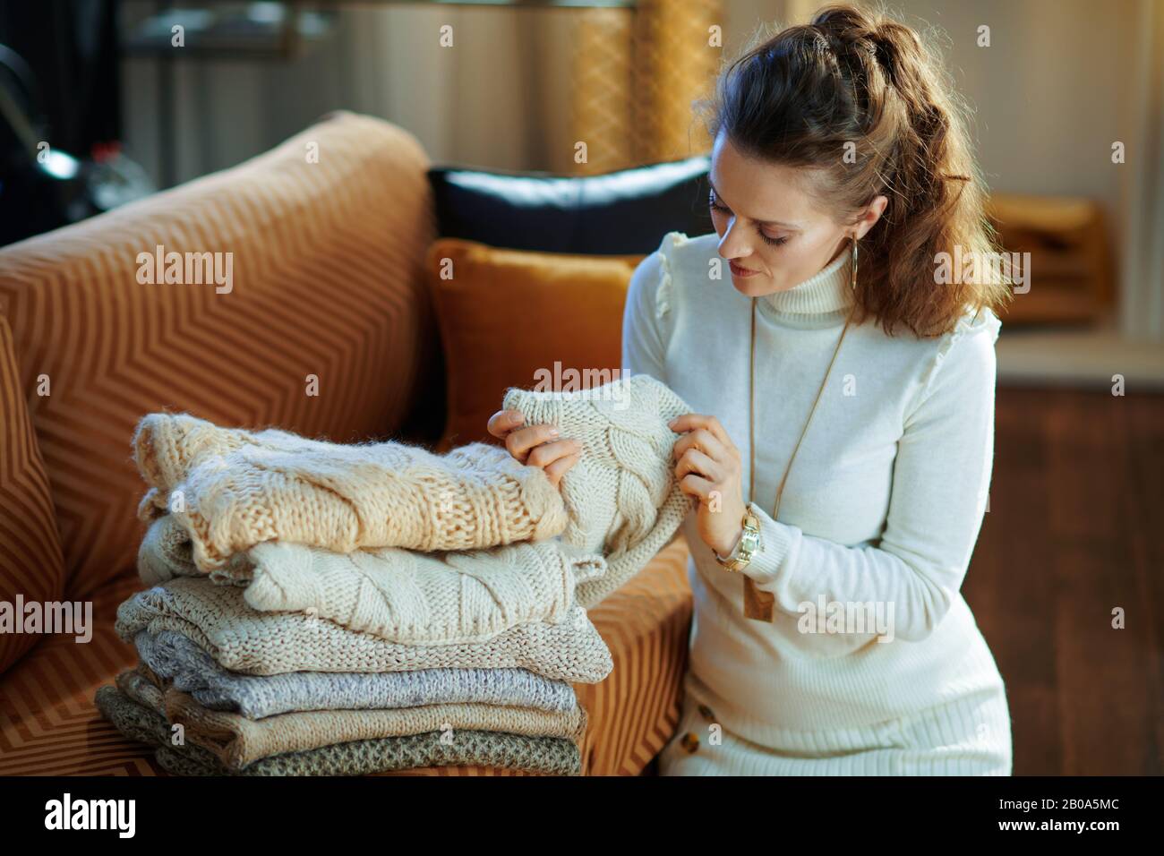 elegant housewife in white sweater and 