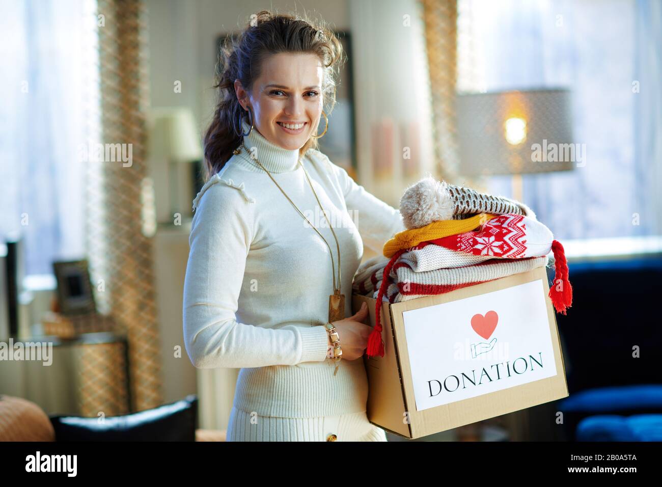 donation box with old warm clothes 