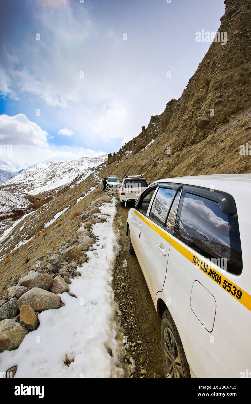 Tourist expedition searching snow leopard in Ulley valley. Ladakh ...
