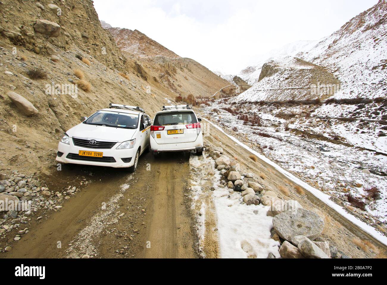 Tourist expedition searching snow leopard in Ulley valley. Ladakh ...