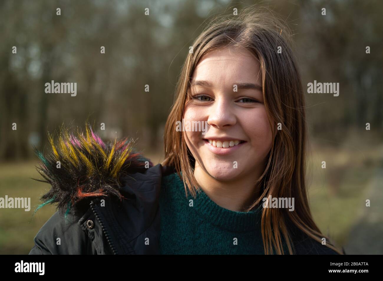 Portrait of a beautiful young teenager girl with perfect skin in park Stock Photo