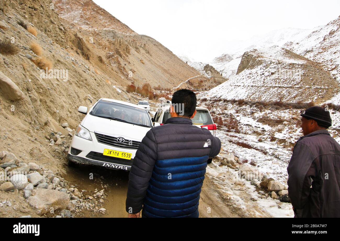 Tourist expedition searching snow leopard in Ulley valley. Ladakh ...