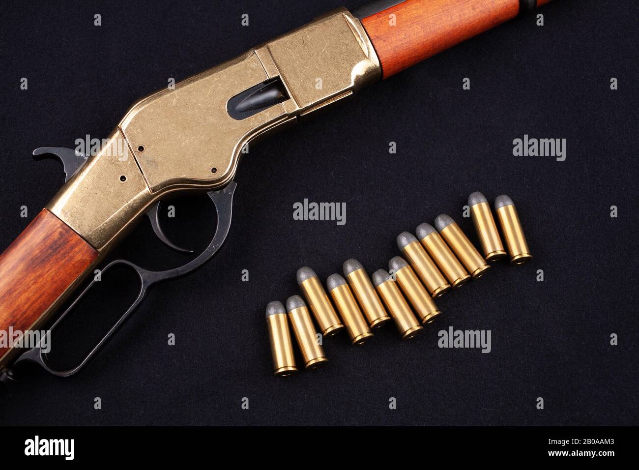 Wild west gun and ammunition on black canvas Stock Photo