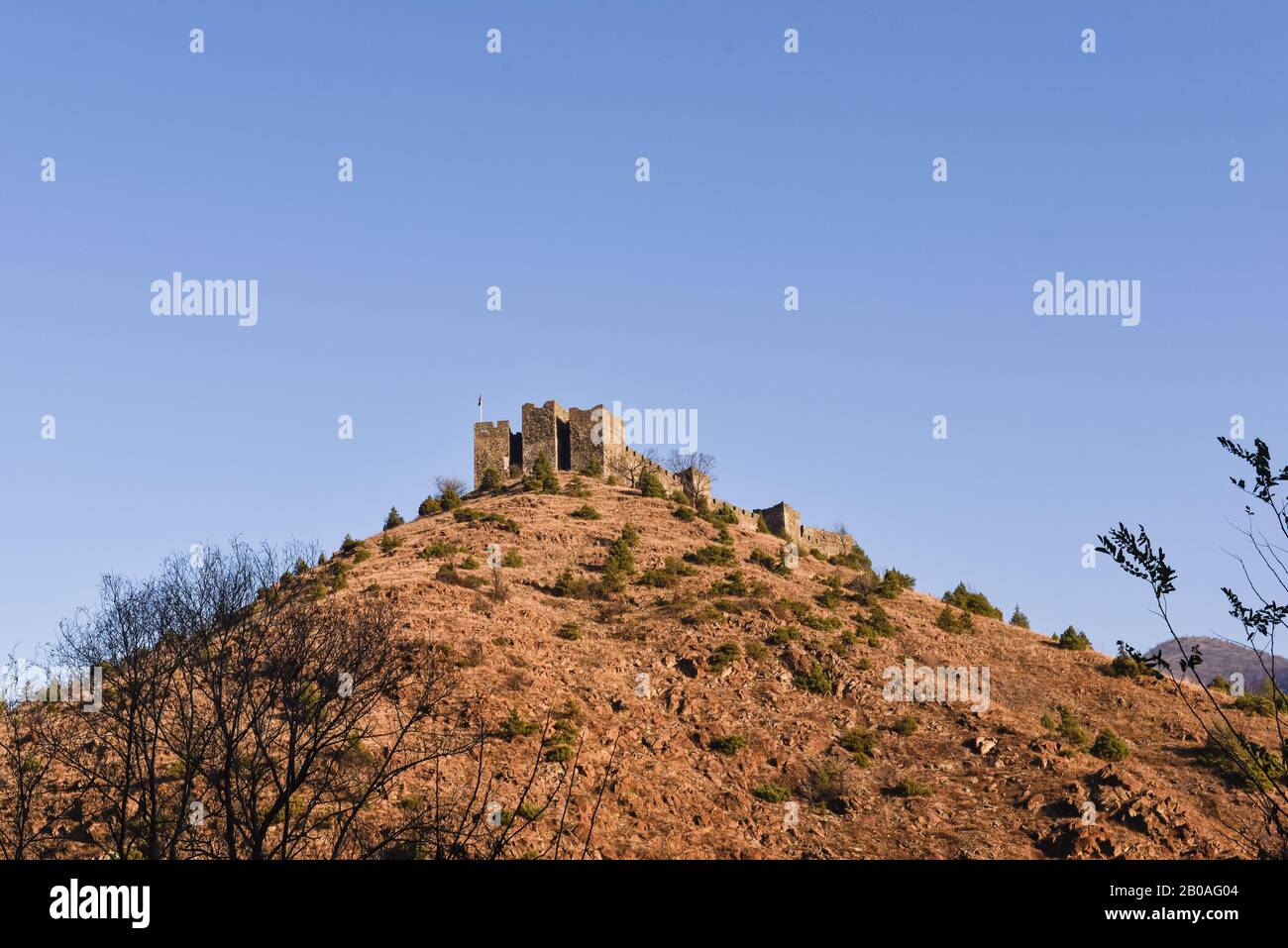 Wider image of Maglic castle standing on top of the hill near Kraljevo in Serbia during the sunny autumn day Stock Photo