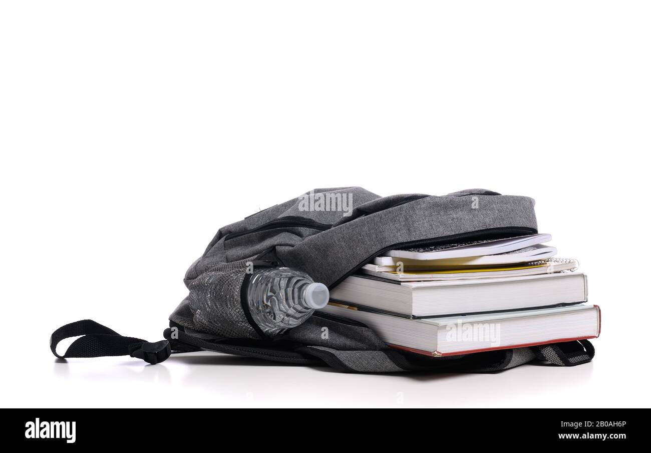 School backpack on a white background with books and spiral notebooks Stock Photo