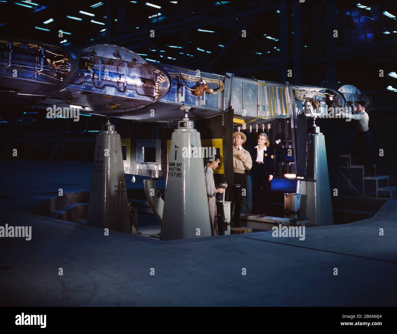 War Production Workers working on Wing of Consolidated Liberator Bomber, Consolidated Aircraft Corp., Fort Worth, Texas, USA, photograph by Howard R. Hollem, U.S. Office of War Information, October 1942 Stock Photo