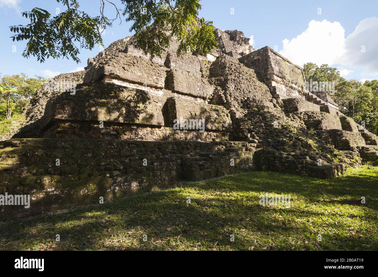 Guatemala, Tikal National Park, Mundo Perdido, Lost World Pyramid, 700 BC, oldest in Tikal, partially excavated backside, talud-tablero architecture; Stock Photo