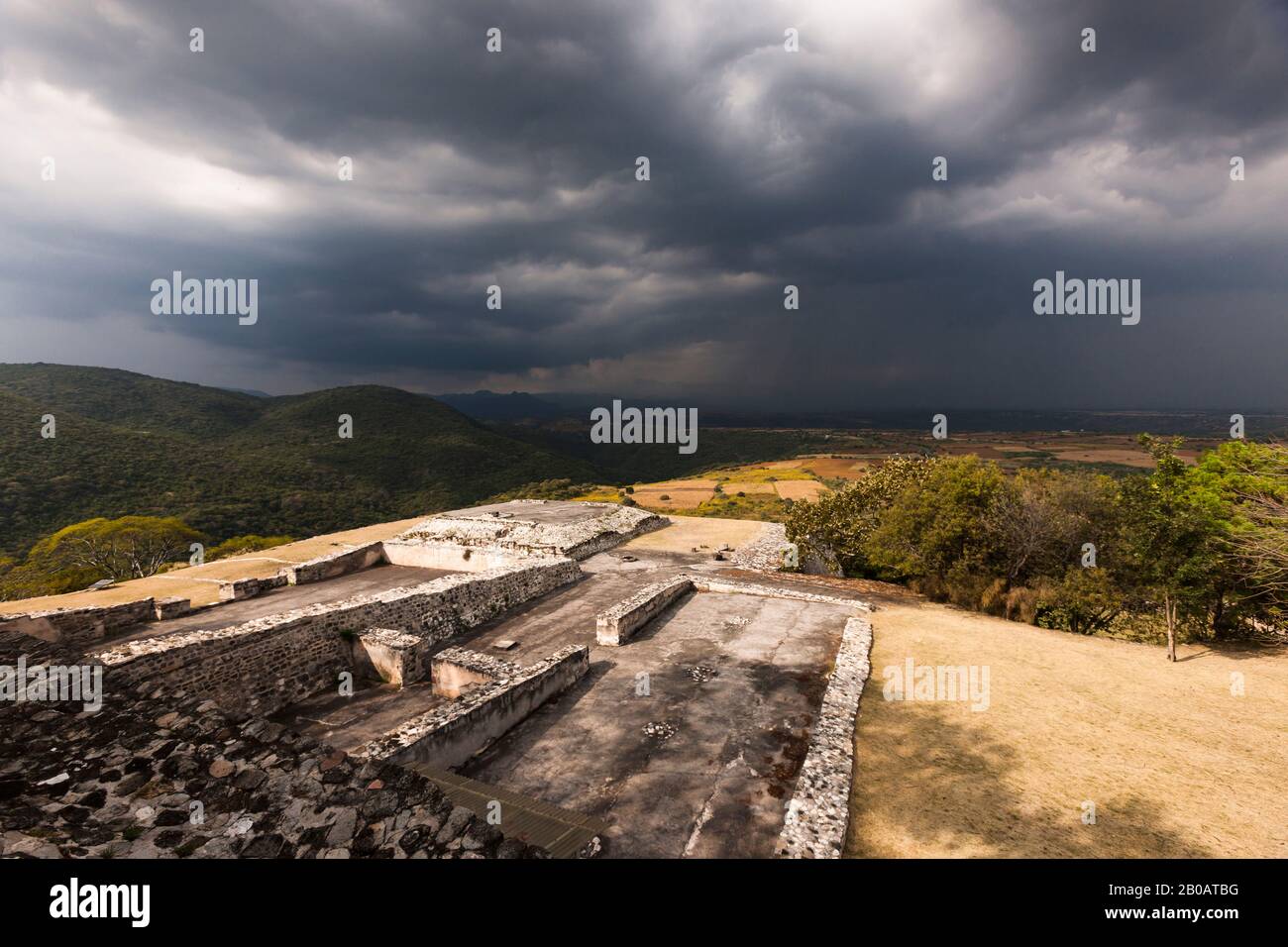Acropolis under black clouds, Xochicalco archaeological site, Mayan Ruins, Morelos, Mexico, Central America Stock Photo