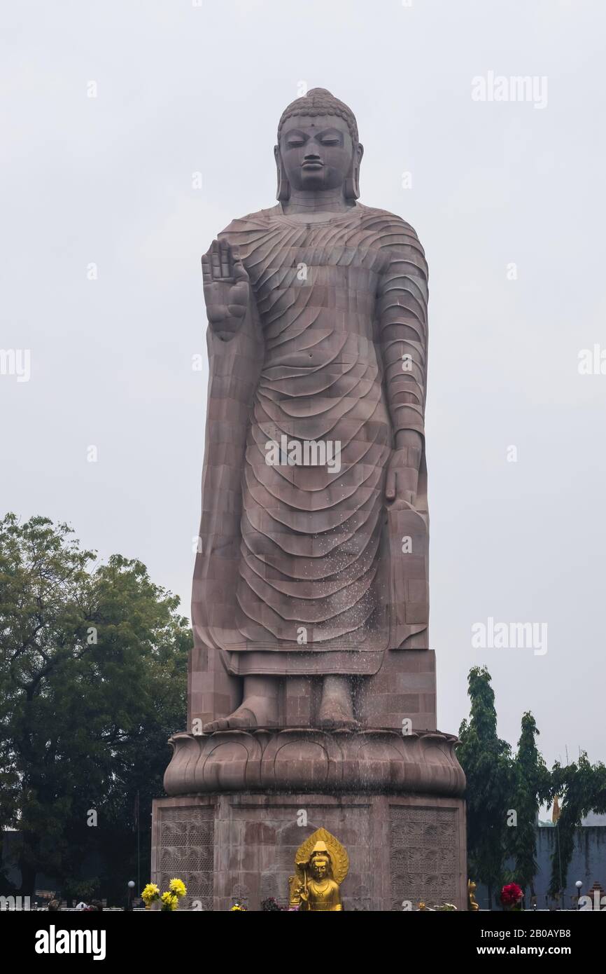 Large statue of standing Buddha in WAT THAI Temple, Sarnath city near Varanasi, India Stock Photo