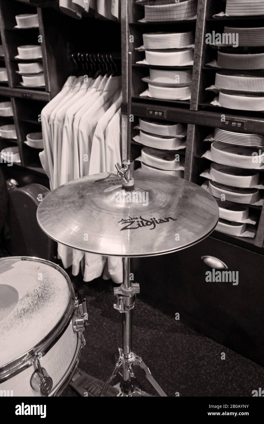 Snare and Cymbals, Musical Instruments as black and white still life  pictures in a bespoke menswear store with shirts, neck ties and bolts of  fabric Stock Photo - Alamy