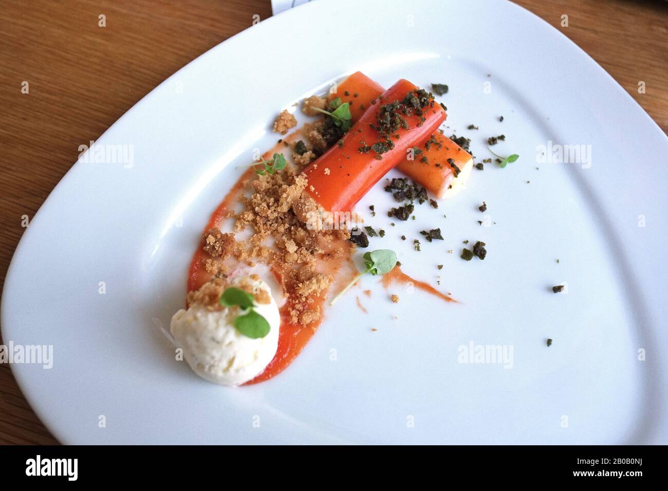 Dessert, Tomato Cannoli With Saffron Crème e Fiordilatte gelato by Danny Russo of Russonlini. Fine dining dishes made with Italian preserved tomatoes Stock Photo