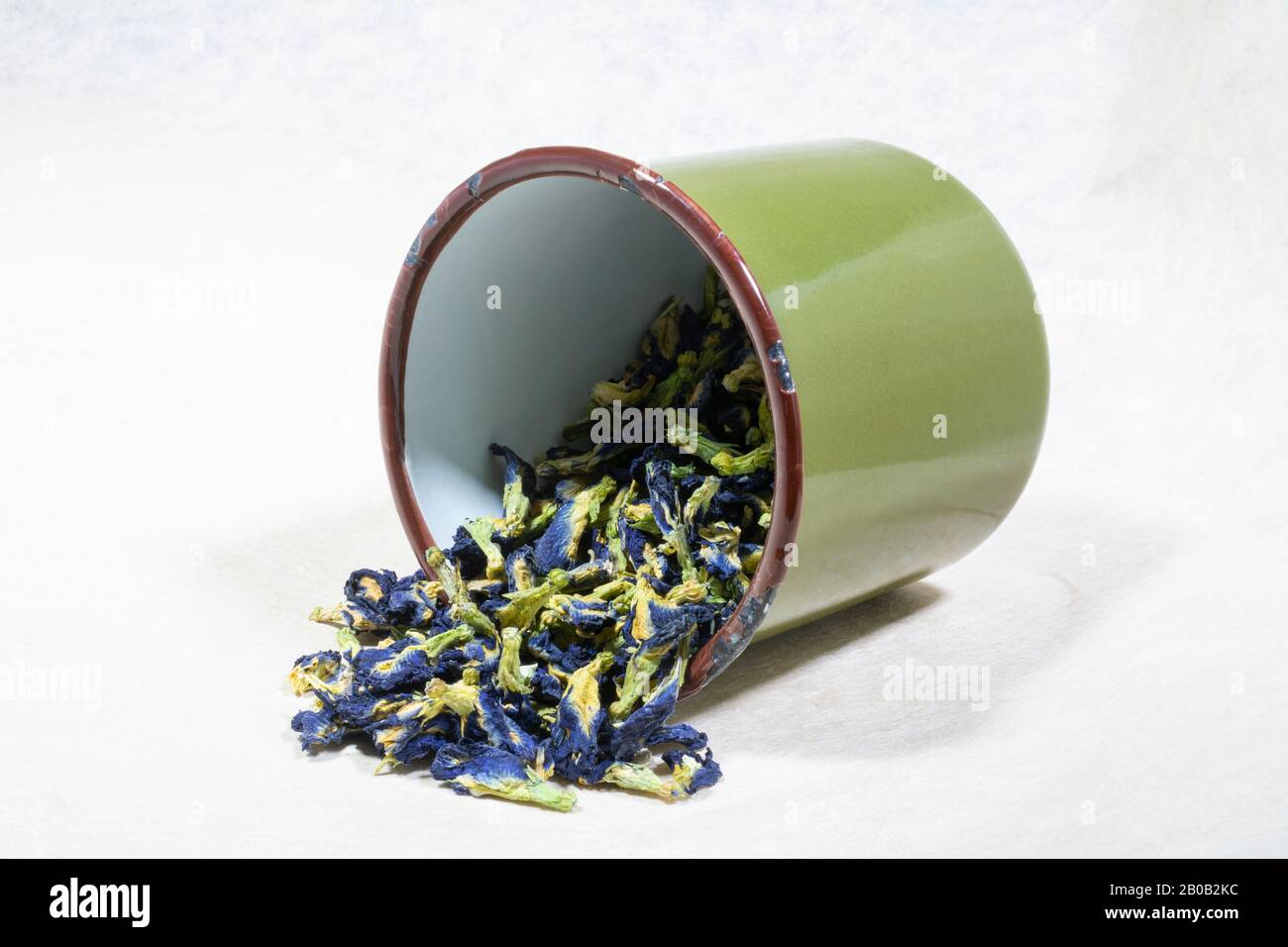Blue flowers of organic dried Butterfly Pea Tea (Clitoria Ternatea) in a enamel mug Stock Photo