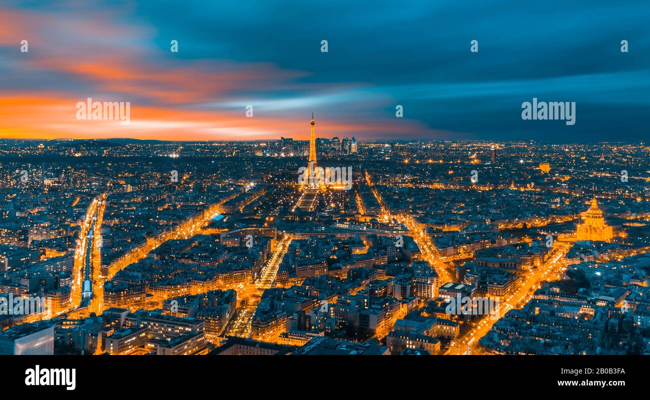 Paris aerial view with Eiffel Tower at night, Skyline of Paris with Eiffel Tower at sunset in Paris, France. Architecture and landmarks of Paris. Stock Photo