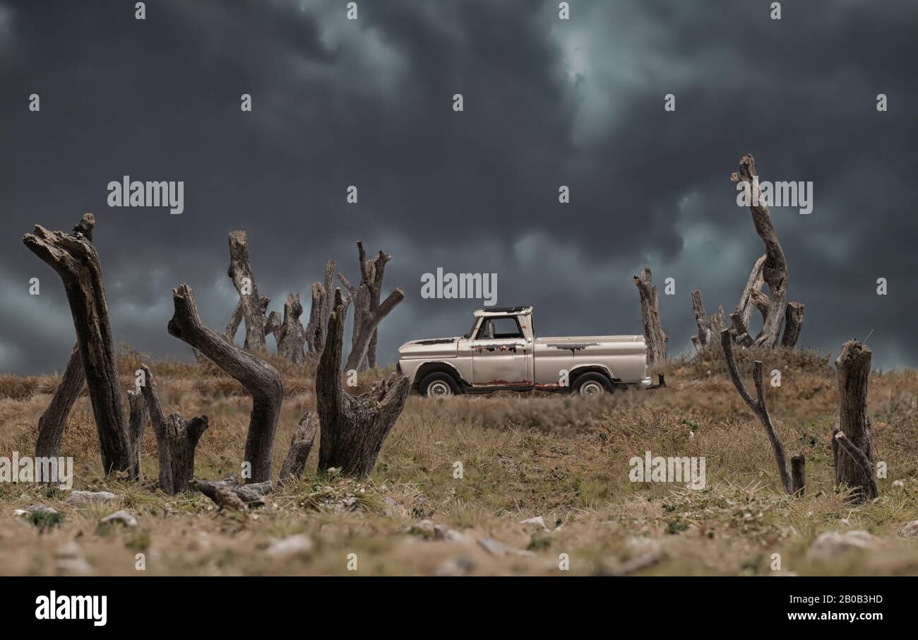 White Pick Up Truck Driving Along Dark, Ominous Path Stock Photo - Alamy