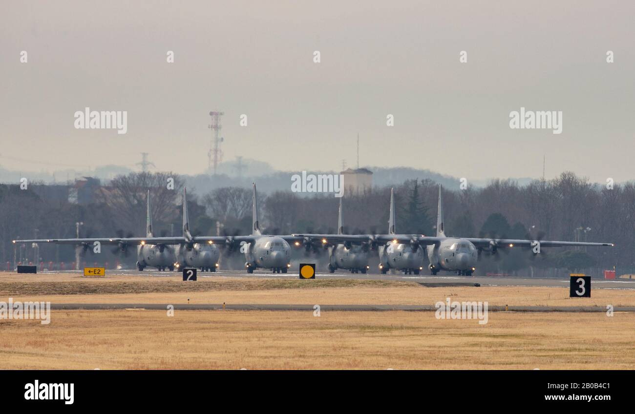 Six C-130J Super Hercules’ assigned to the 36th Airlift Squadron and 61st AS, Little Rock Air Force Base, Arkansas, perform an Elephant Walk at Yokota AB, Japan, as part of a capstone exercise taking place in the Indo-Pacific Command's area of responsibility, Feb. 14, 2020. This capstone and agile combat employment provides a unique training opportunity while exposing 19th AS Airmen to the Indo-Pacom area. (U.S. Air Force Photo by Yasuo Osakabe) Stock Photo