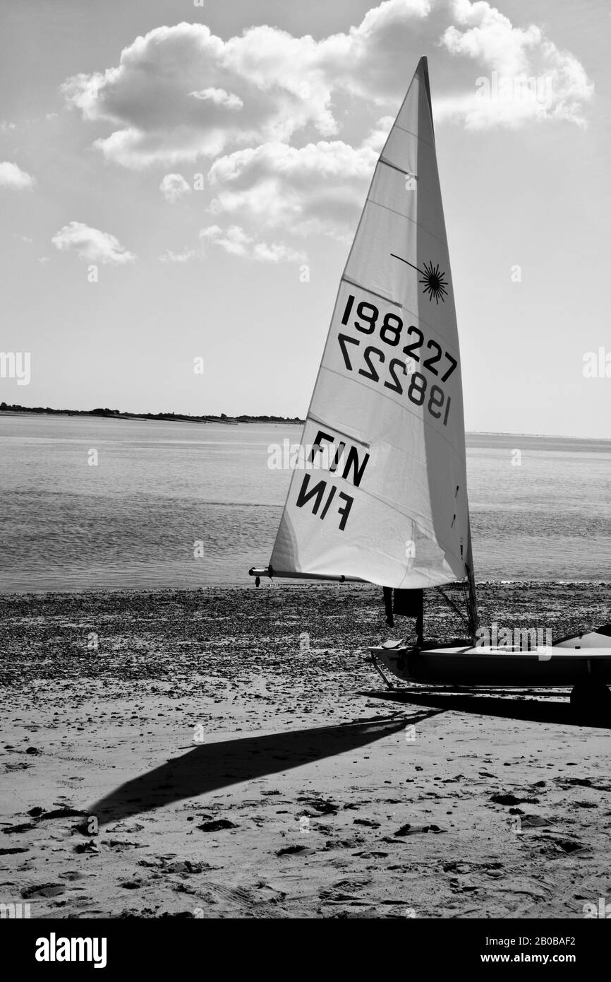 Finnish Laser sailing dinghy rigged and on beach waiting to race Stock Photo