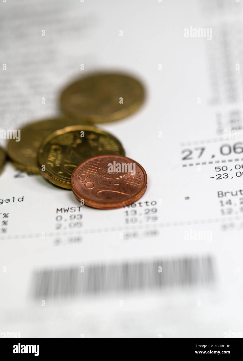 Receipt with change, cent coins Stock Photo