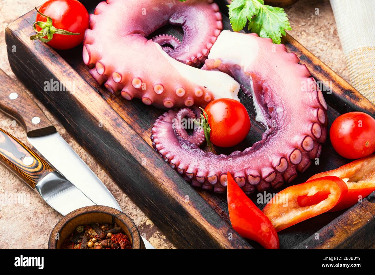 Tentacles of raw octopus on kitchen board.Food diet,healthy eating