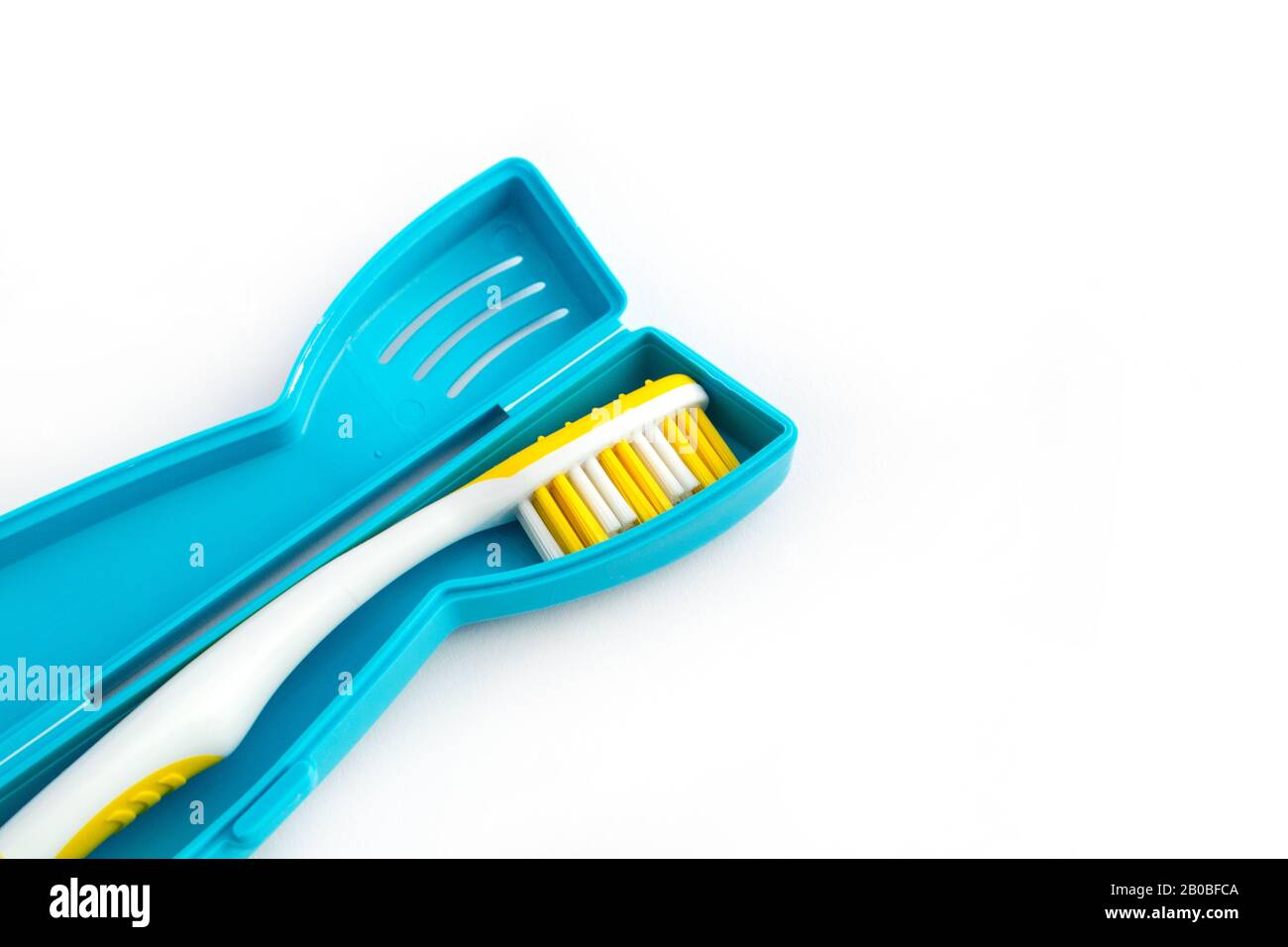 Toothbrush in a plastic case on white background Stock Photo