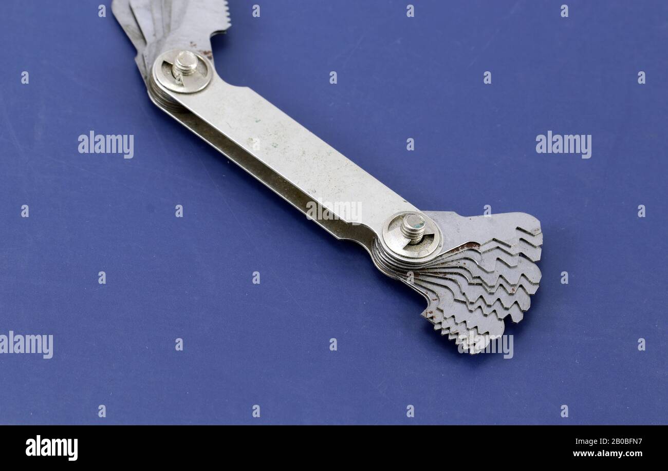 Bench tool for measuring thread pitch gauge. Stock Photo