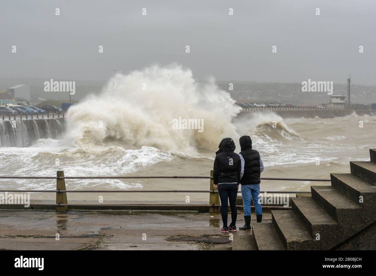 Newhaven, East Sussex. UK weather. Storm Ciara crashes into the harbour wall with spectators watching on 9th February 2020. Stock Photo