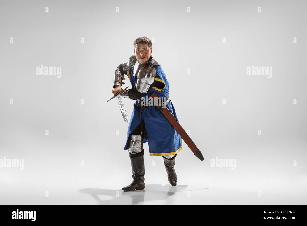 Brave armored knight with professional weapon fighting isolated on ...