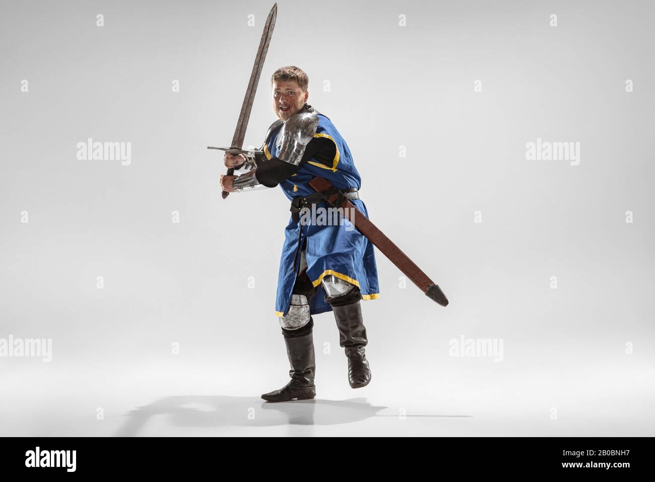 Brave armored knight with professional weapon fighting isolated on ...