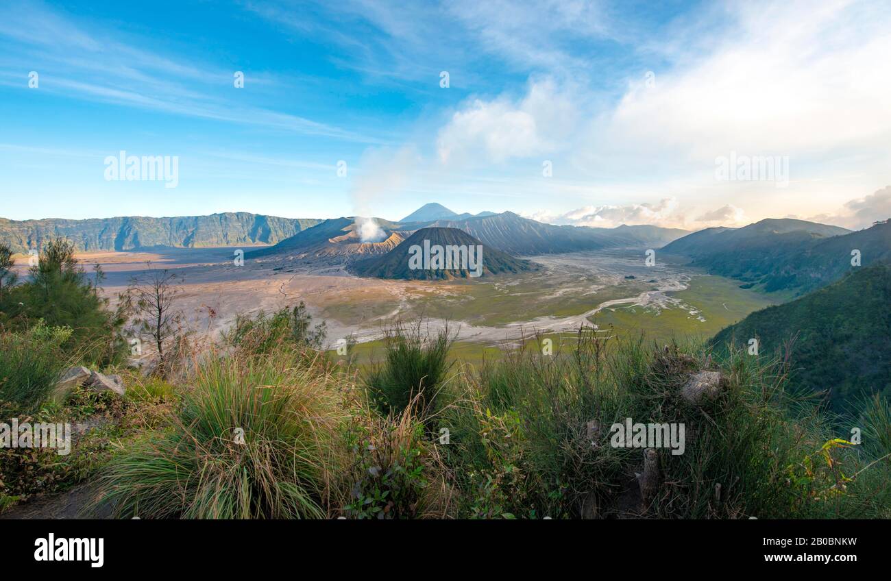 View of volcanic landscape, volcanoes, smoking volcano Gunung Bromo, Mt. Batok, Mt. Kursi, Mt. Gunung Semeru, Bromo-Tengger-Semeru National Park Stock Photo