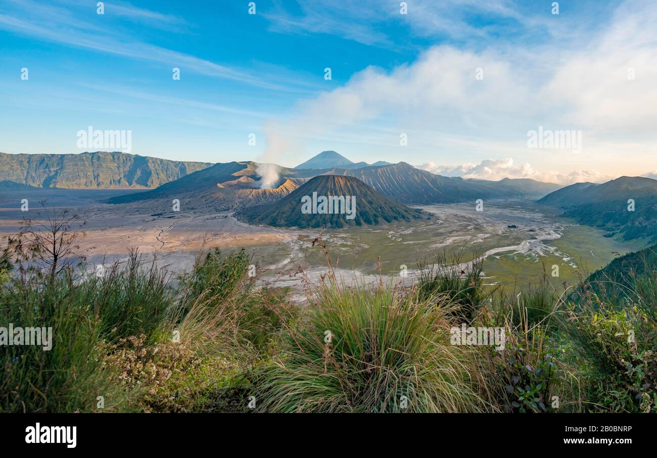 View of volcanic landscape, volcanoes, smoking volcano Gunung Bromo, Mt. Batok, Mt. Kursi, Mt. Gunung Semeru, Bromo-Tengger-Semeru National Park Stock Photo