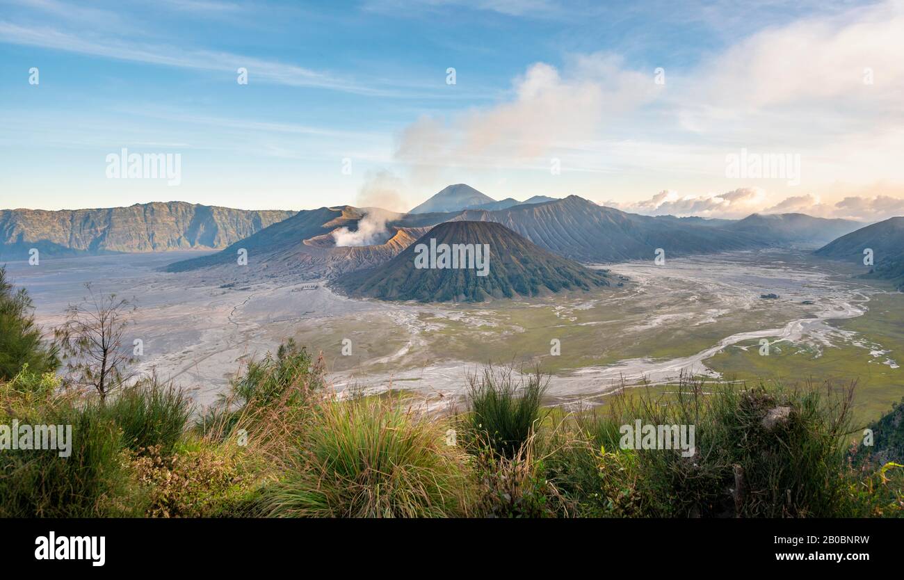 View of volcanic landscape, volcanoes, smoking volcano Gunung Bromo, Mt. Batok, Mt. Kursi, Mt. Gunung Semeru, Bromo-Tengger-Semeru National Park Stock Photo